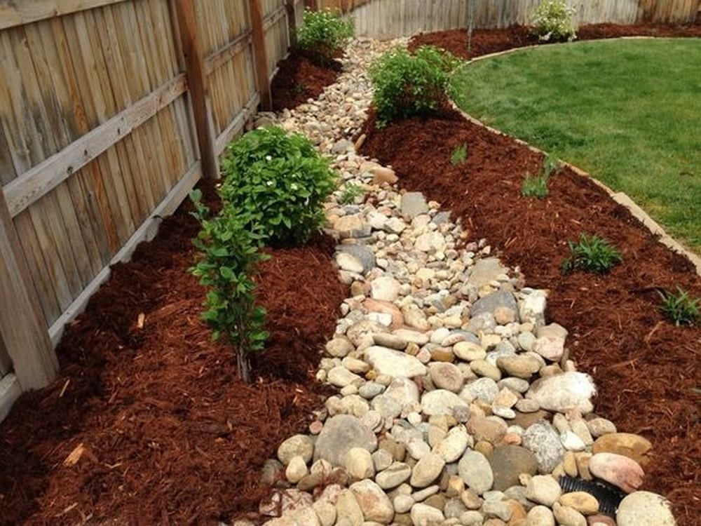 A dry creek bed can help control and re-direct the flow of water.