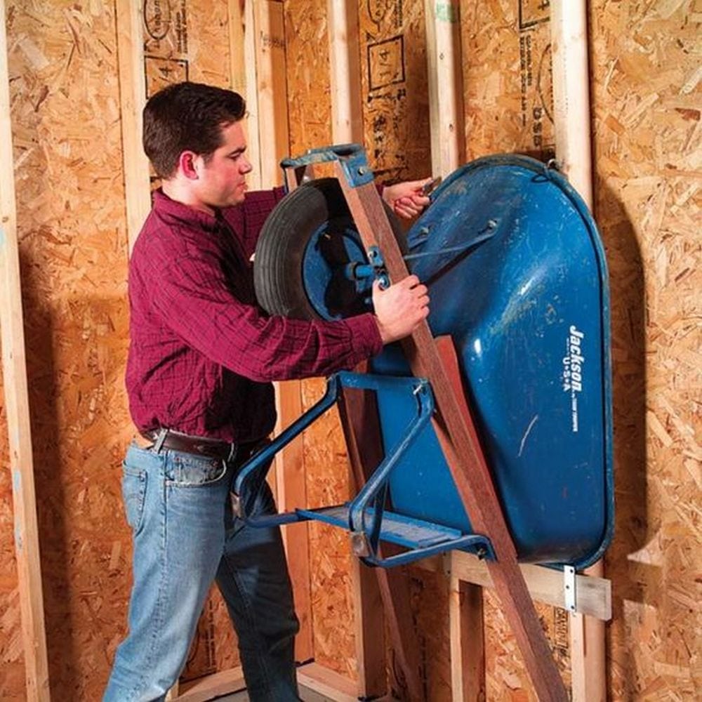 Get that wheelbarrow off the garage floor and on to the wall!