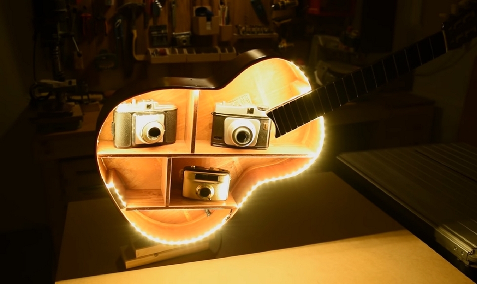 Got an old acoustic guitar that's no longer being used? Turn it into a guitar shelf!