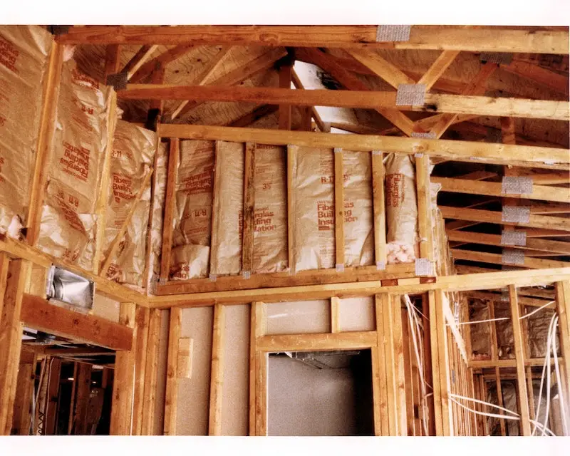 An image of ceiling insulation being installed for a house.