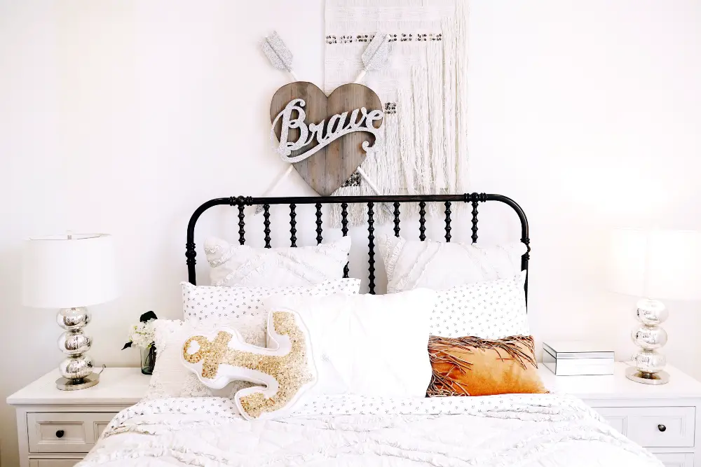 An image of a boy's bedroom with white tones.