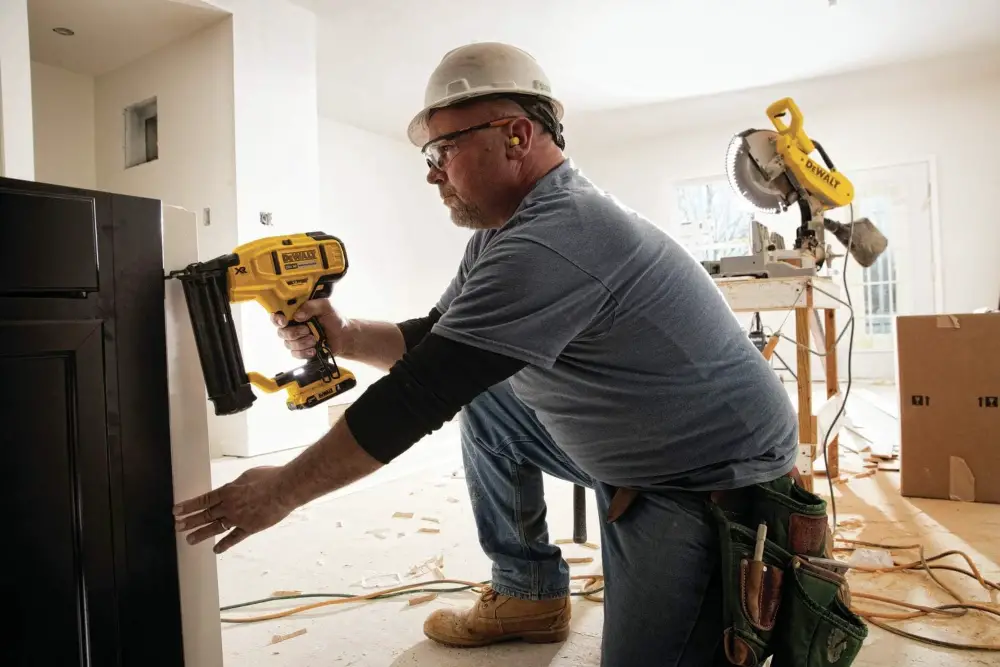 A worker using a Brad Nailer